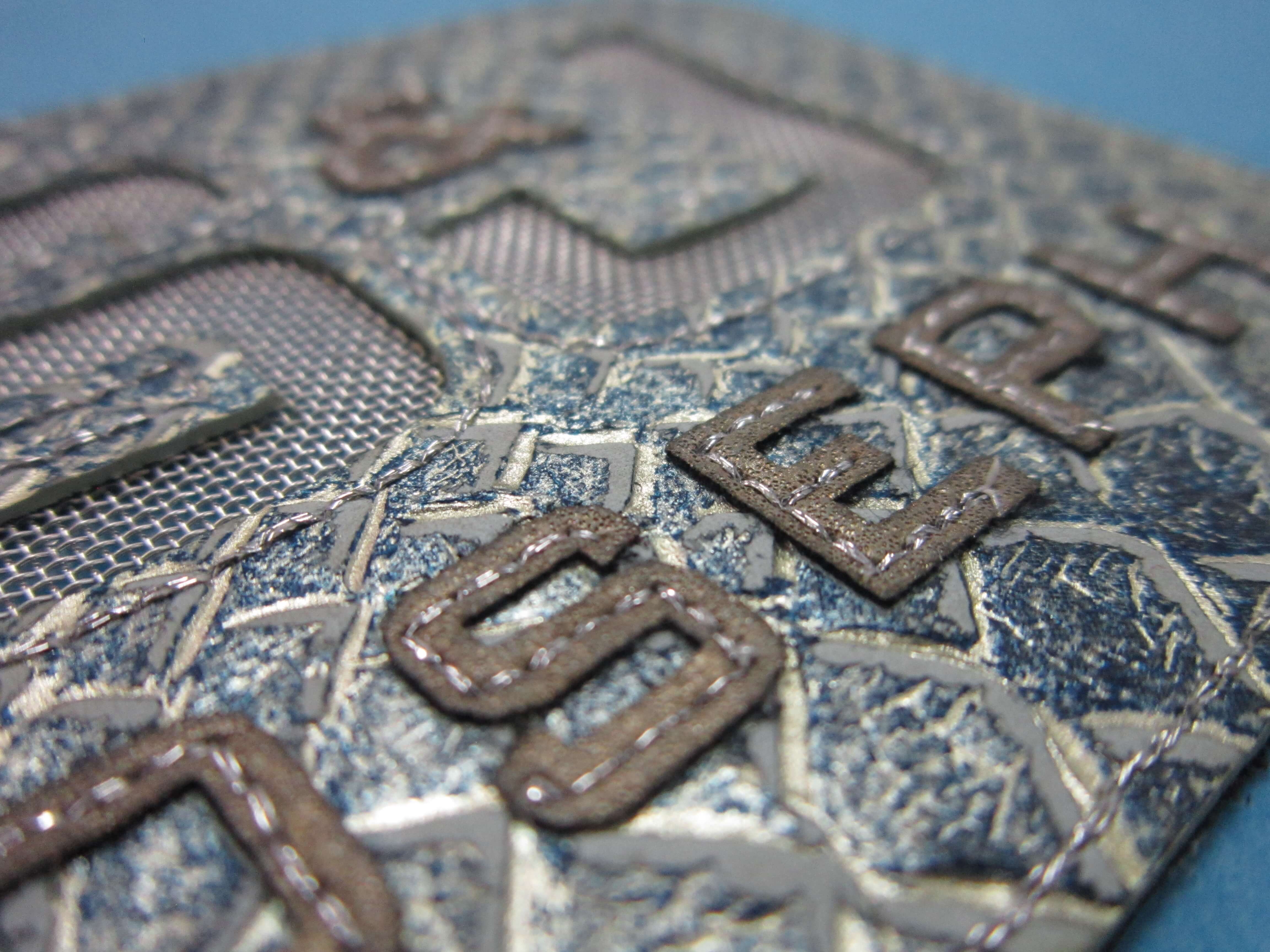 Overlying text laser cut